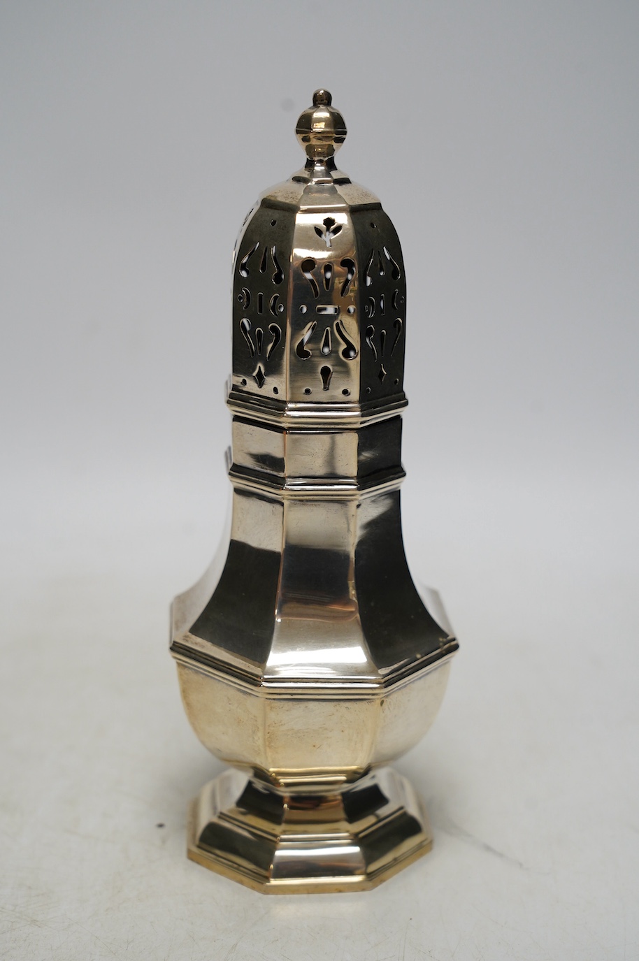 A George VI silver octagonal sugar caster, Goldsmiths & Silversmiths Co Ltd, London, 1937, 21cm, 8.7oz. Condition - fair to good